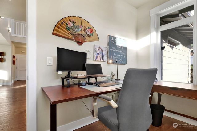 a workspace with furniture and window