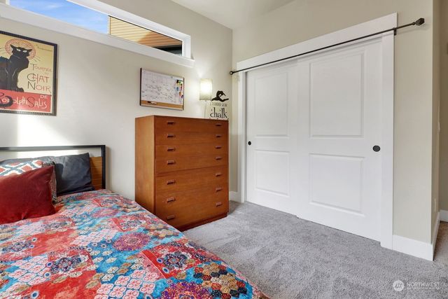 a bedroom with a bed and a cabinets