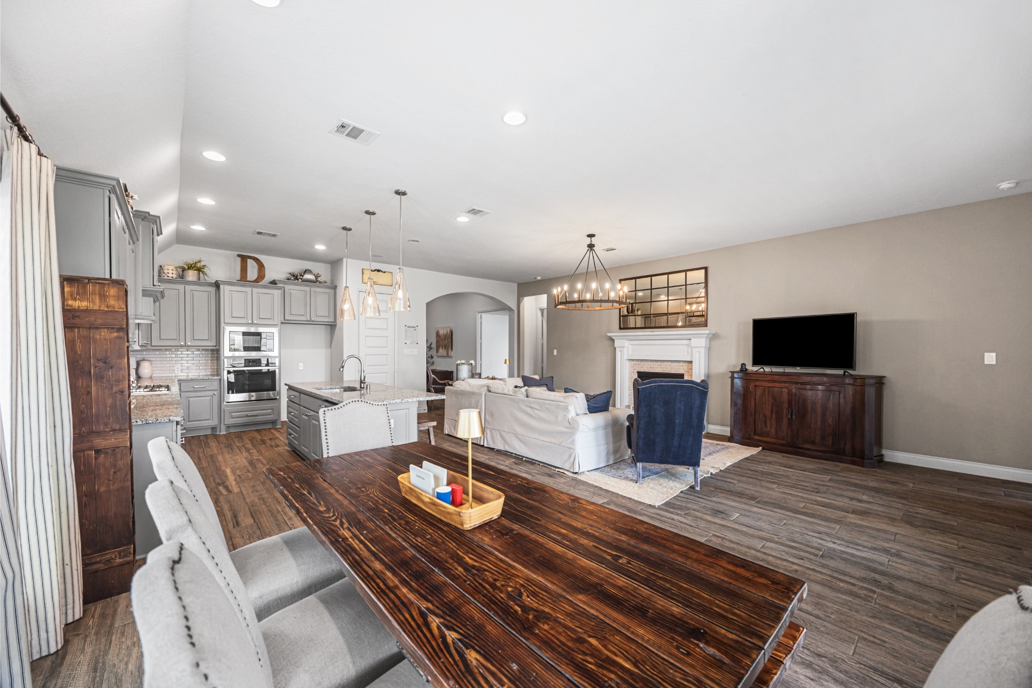 28169 Knight Peak Drive Spring, TX 77386 - Photo 11 of 33 a living room with furniture kitchen view and a refrigerator