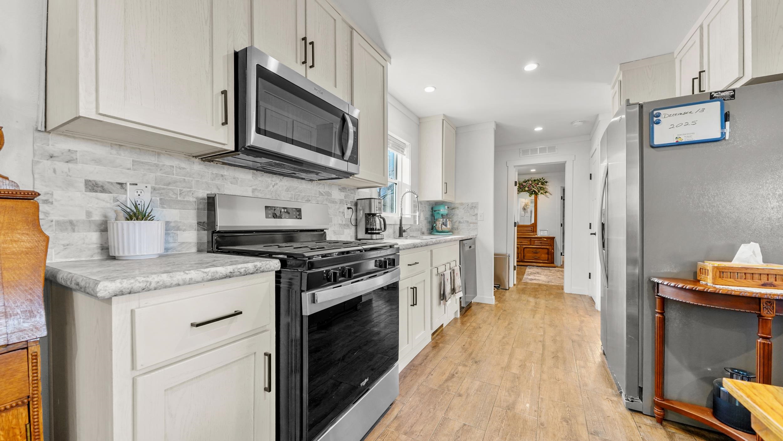 1296 M M 1/4 Road Loma, CO 81524 - Photo 11 of 30 a kitchen with stainless steel appliances granite countertop a stove and a sink