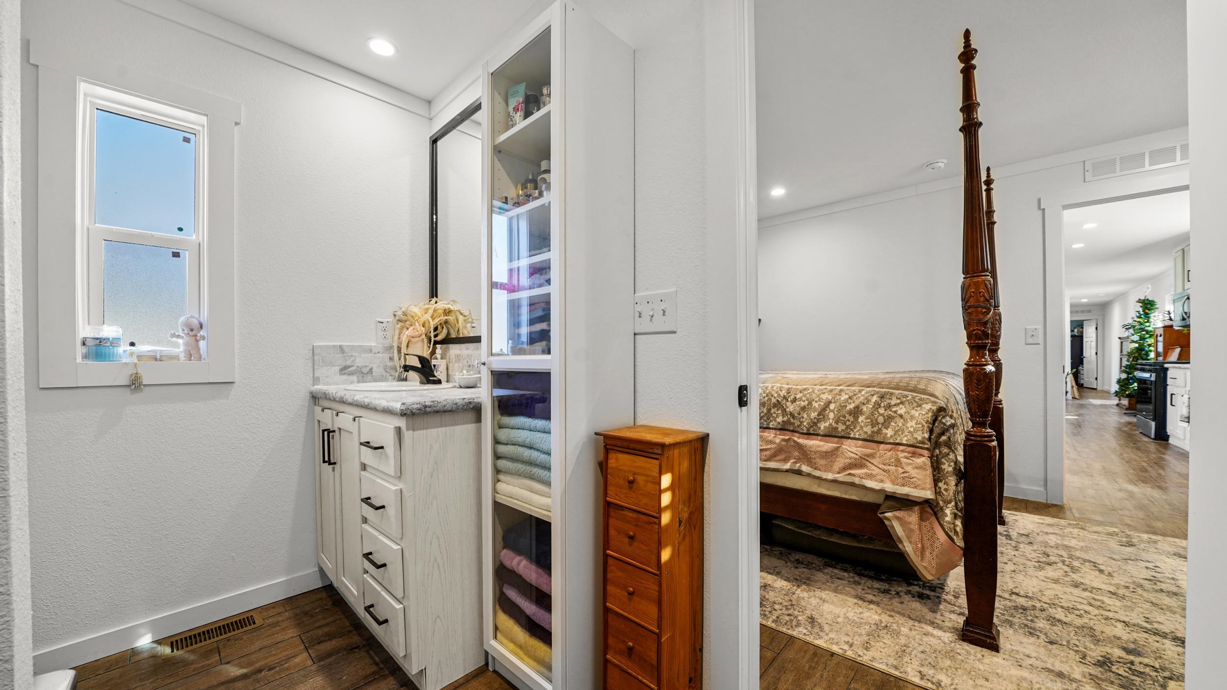 1296 M M 1/4 Road Loma, CO 81524 - Photo 16 of 30 a en suite bathroom with a sink a mirror and shower