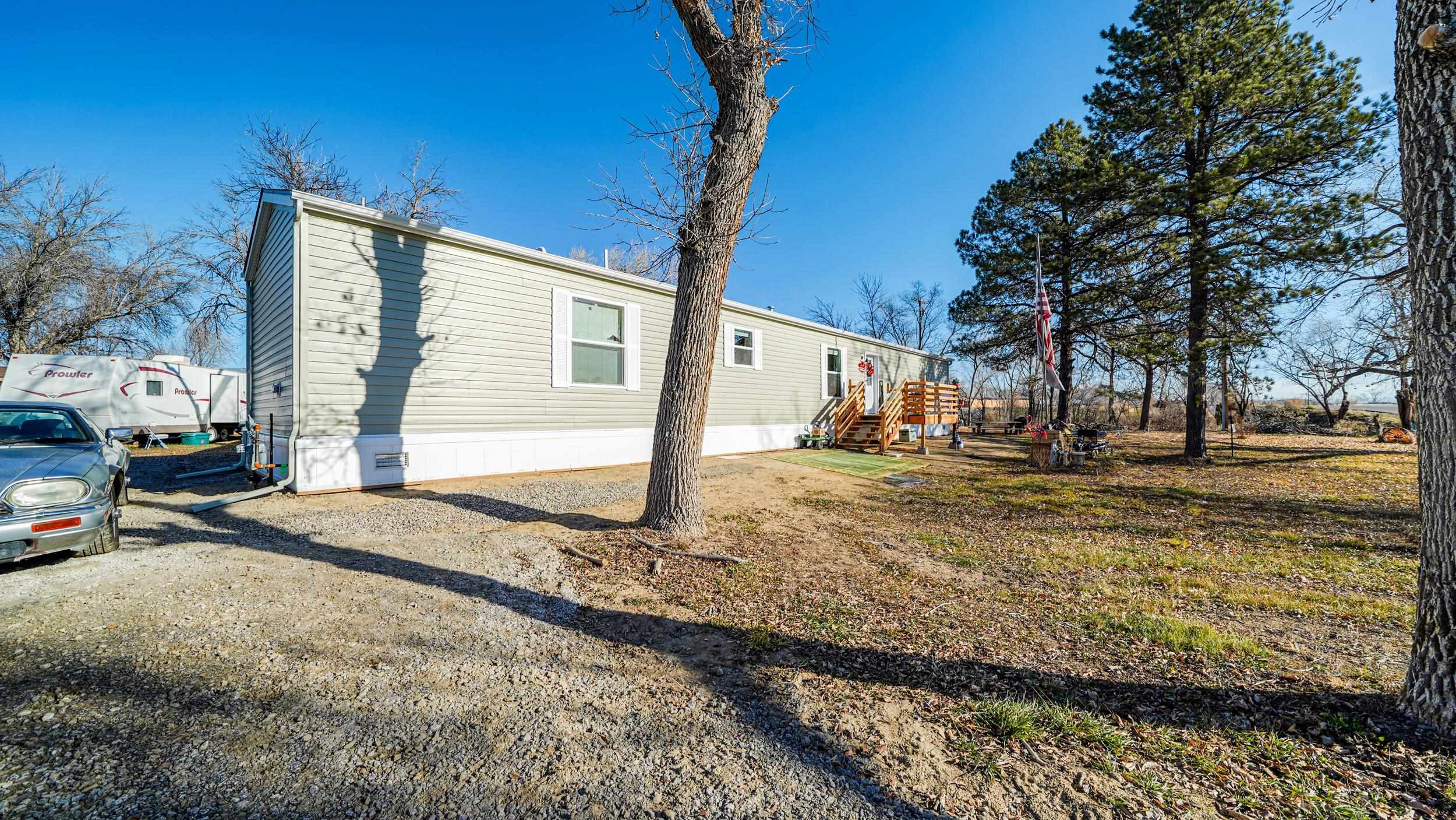 1296 M M 1/4 Road Loma, CO 81524 - Photo 2 of 30 a view of a yard with cars on road