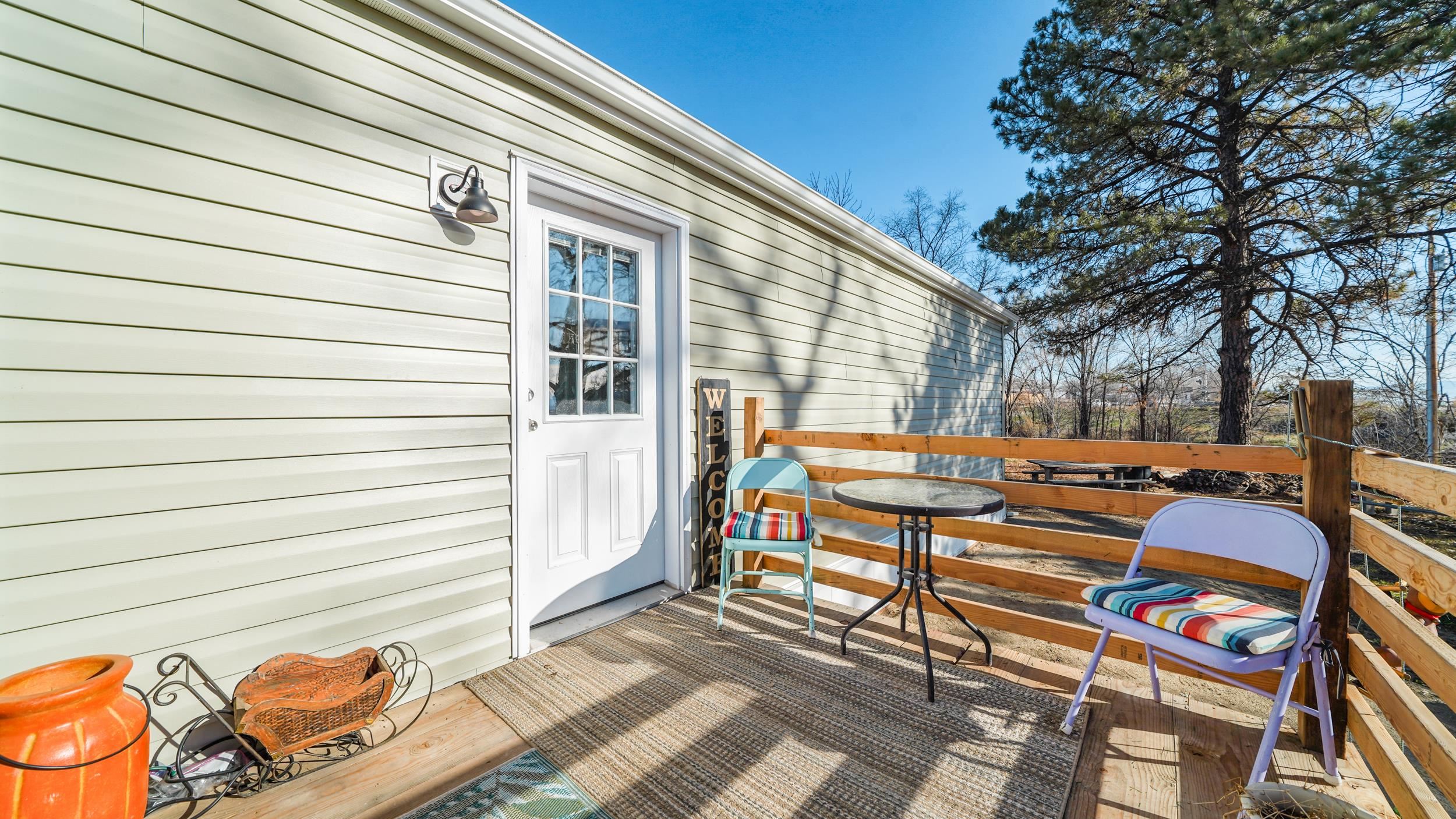1296 M M 1/4 Road Loma, CO 81524 - Photo 5 of 30 a backyard of a house with barbeque oven table and chairs