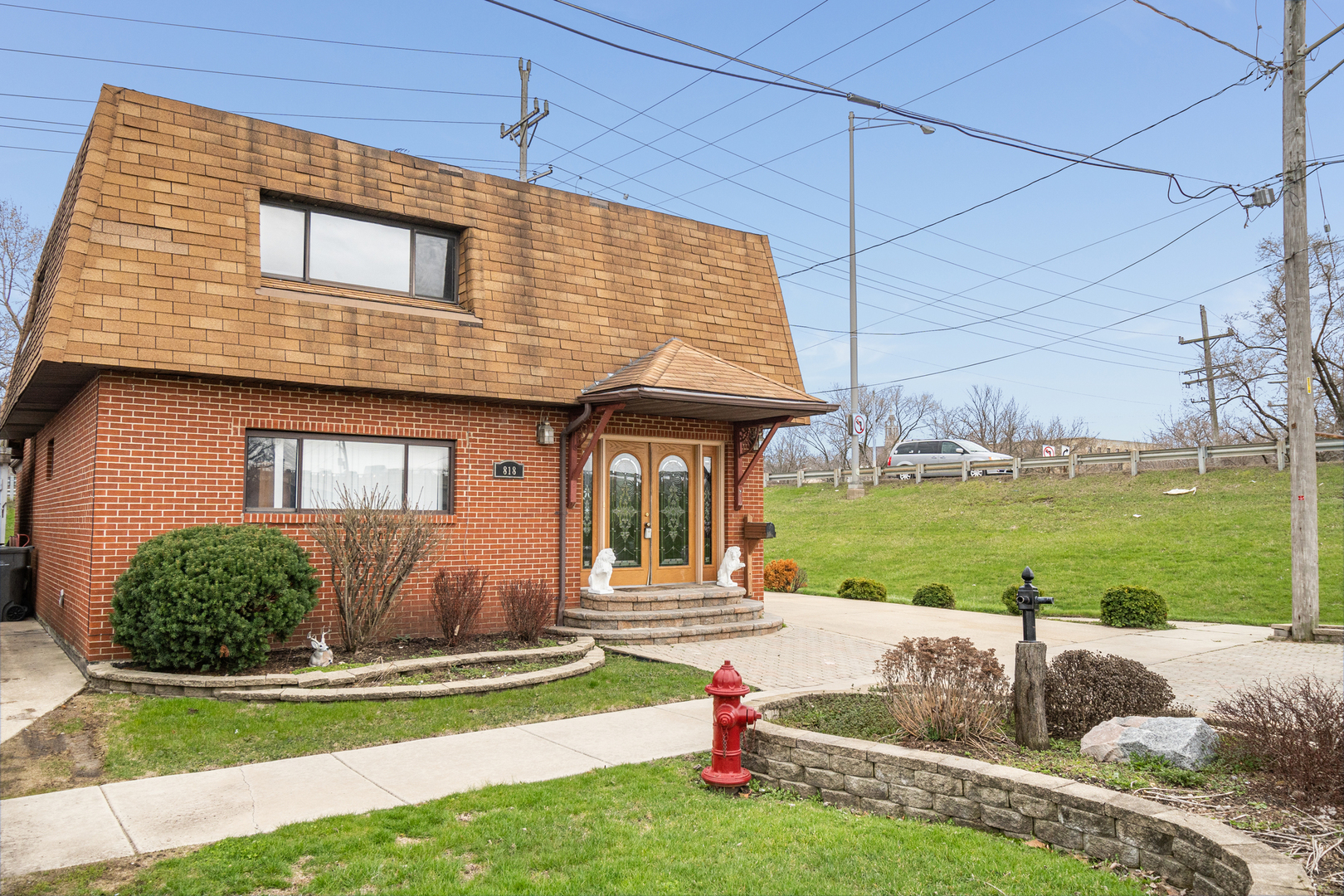 a front view of a house with garden