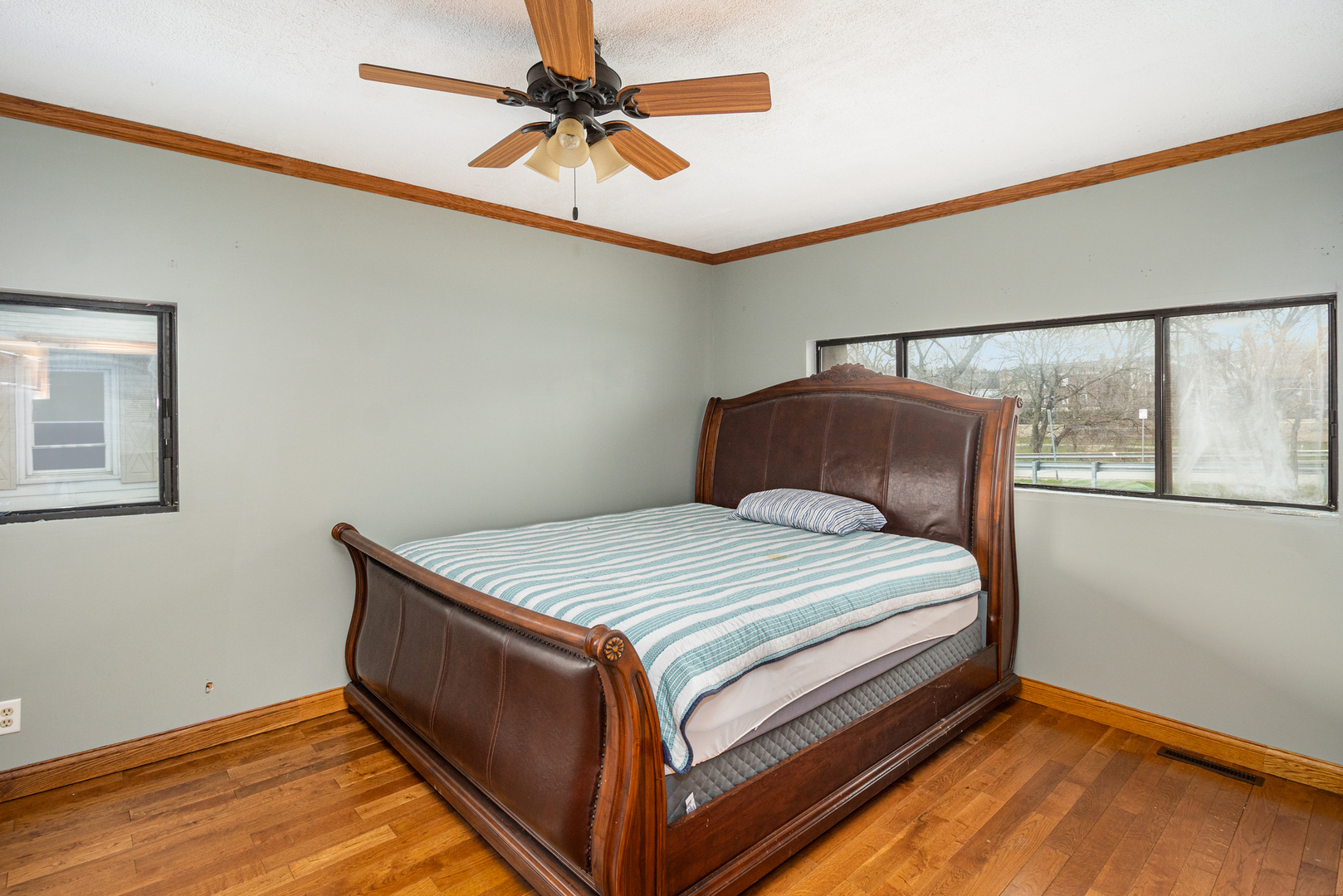 818 Clinton Street Lockport, IL 60441 - Photo 13 of 23 a bedroom with a bed and window