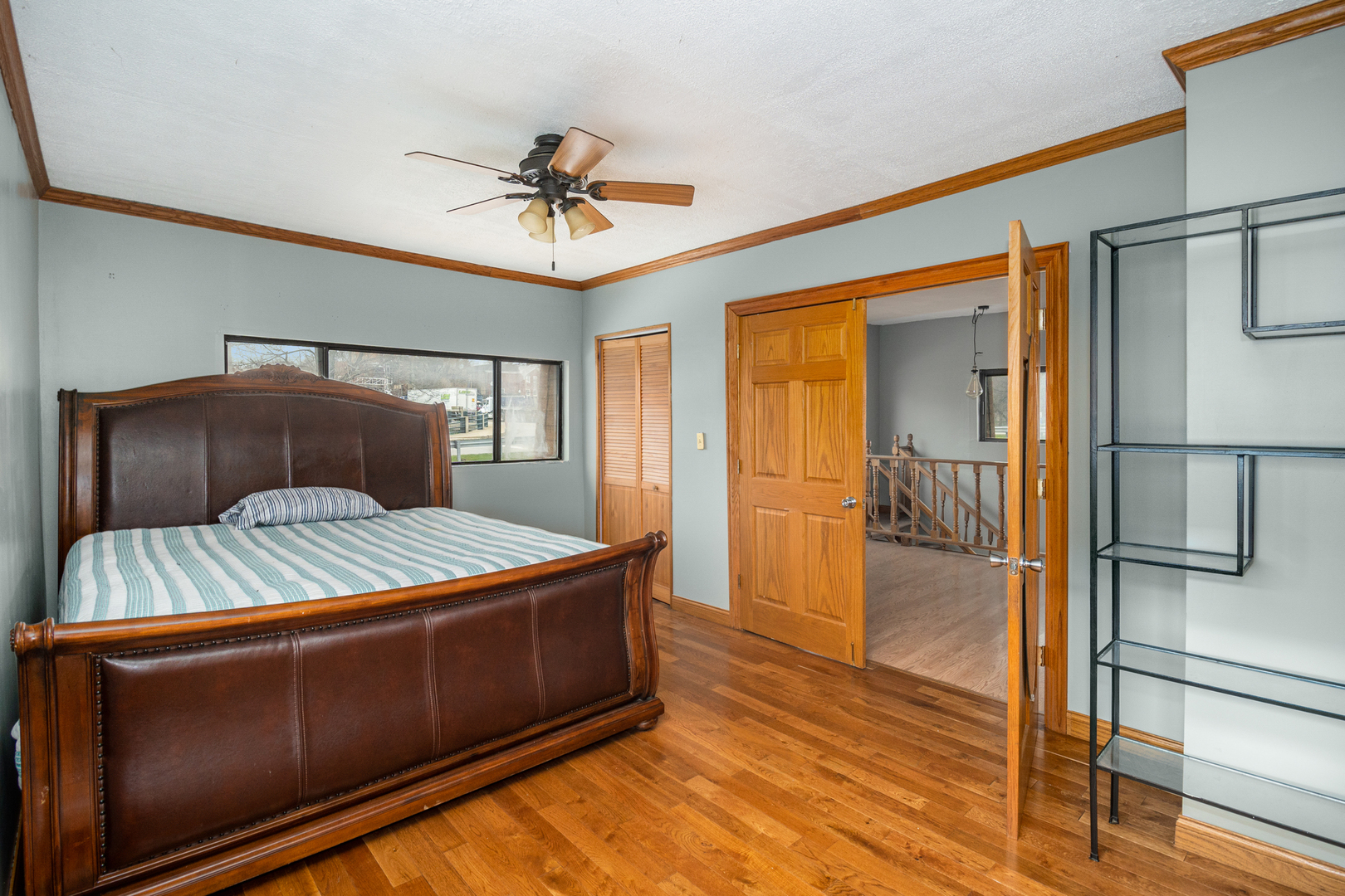 818 Clinton Street Lockport, IL 60441 - Photo 15 of 23 a bedroom with a bed and wooden floor