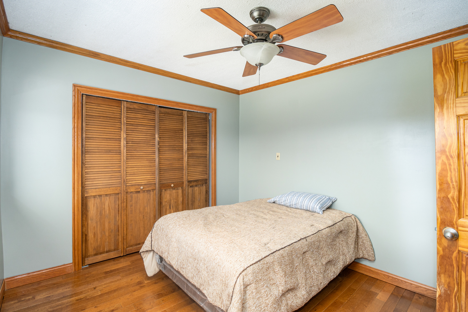 818 Clinton Street Lockport, IL 60441 - Photo 17 of 23 a bedroom with a bed and a window