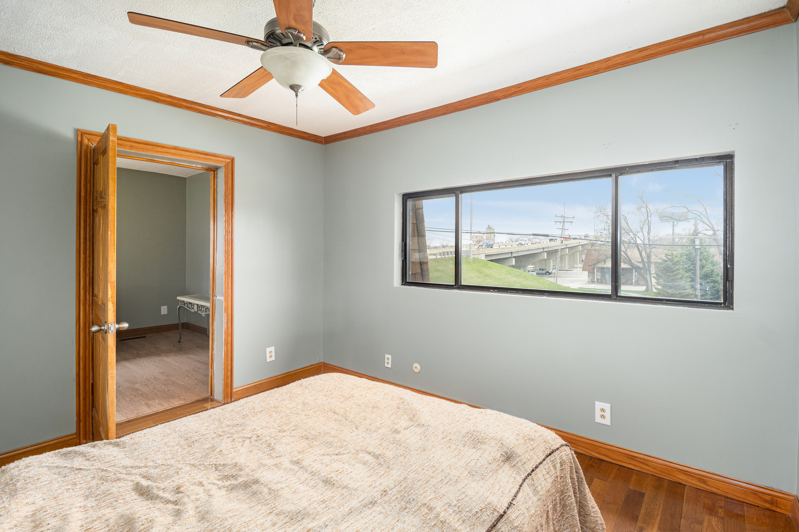 818 Clinton Street Lockport, IL 60441 - Photo 18 of 23 a bedroom with a bed and a painting on the wall