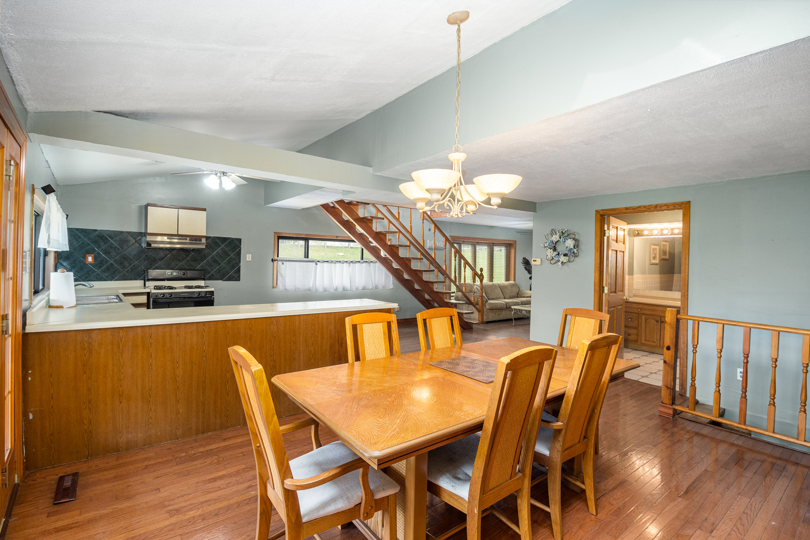 818 Clinton Street Lockport, IL 60441 - Photo 7 of 23 a view of a dining room with furniture and a chandelier