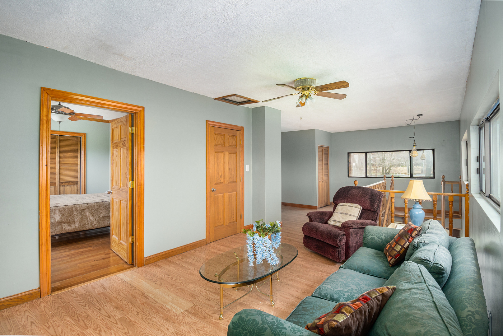 818 Clinton Street Lockport, IL 60441 - Photo 8 of 23 a living room with furniture and a large window