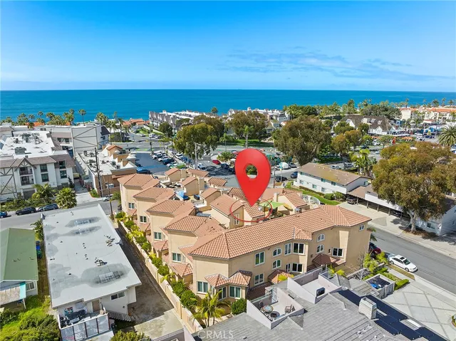 a view of a terrace with lawn chairs