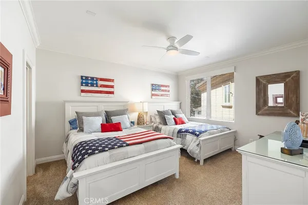 a bedroom with a bed and a desk