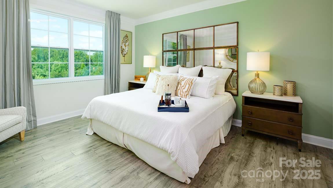 7641 Bainbridge Road Sherrills Ford, NC 28673 - Photo 14 of 29 a bed sitting in a bedroom next to a window