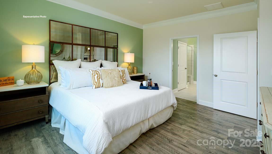 7641 Bainbridge Road Sherrills Ford, NC 28673 - Photo 16 of 29 a bed room with a bed and a lamp