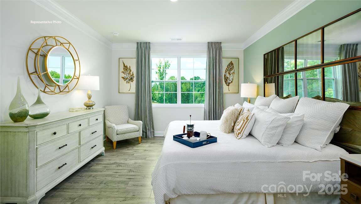 7641 Bainbridge Road Sherrills Ford, NC 28673 - Photo 17 of 29 a bedroom with a bed and a large window