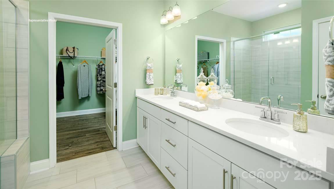 7641 Bainbridge Road Sherrills Ford, NC 28673 - Photo 19 of 29 a bathroom with a double vanity sink mirror and shower