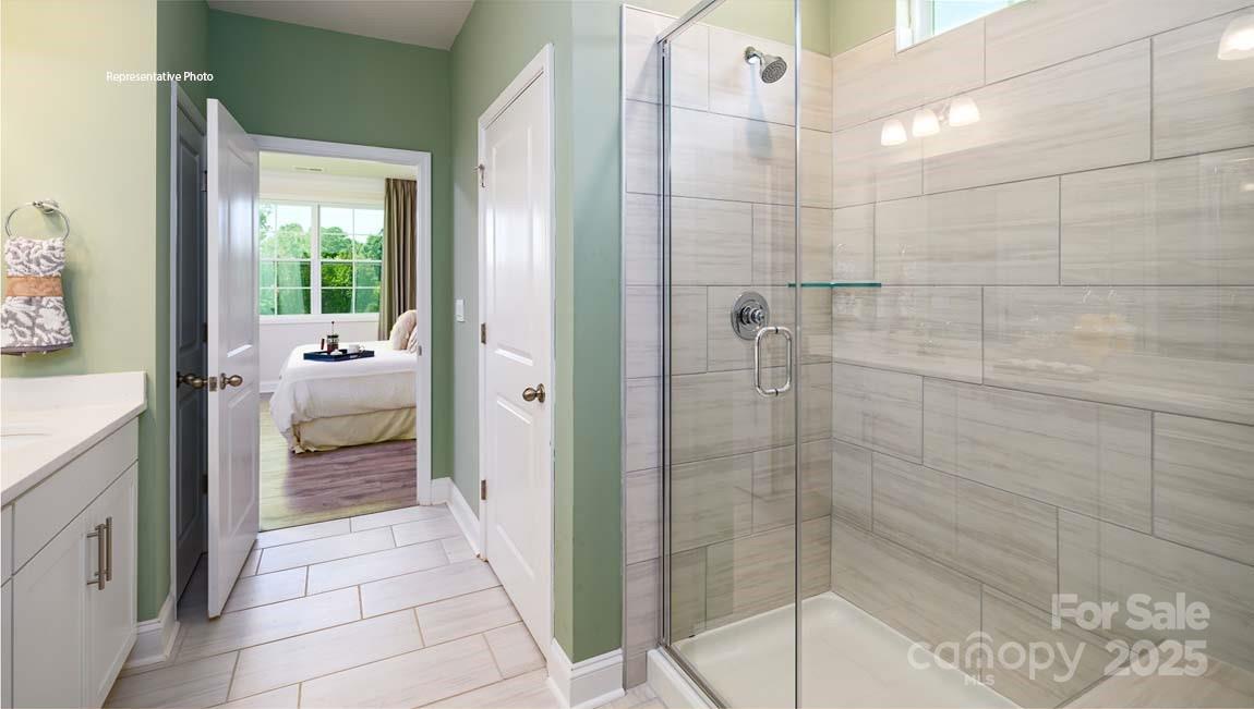 7641 Bainbridge Road Sherrills Ford, NC 28673 - Photo 20 of 29 a bathroom with a glass door shower