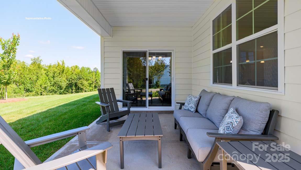 7641 Bainbridge Road Sherrills Ford, NC 28673 - Photo 29 of 29 a view of a patio with couches chairs and a yard