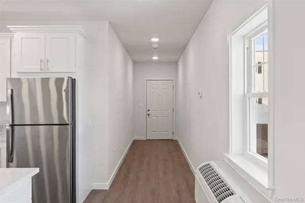 a view of a kitchen from the hallway