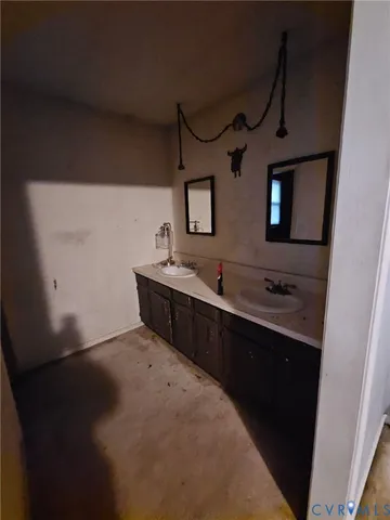 a bathroom with double vanity and a sink