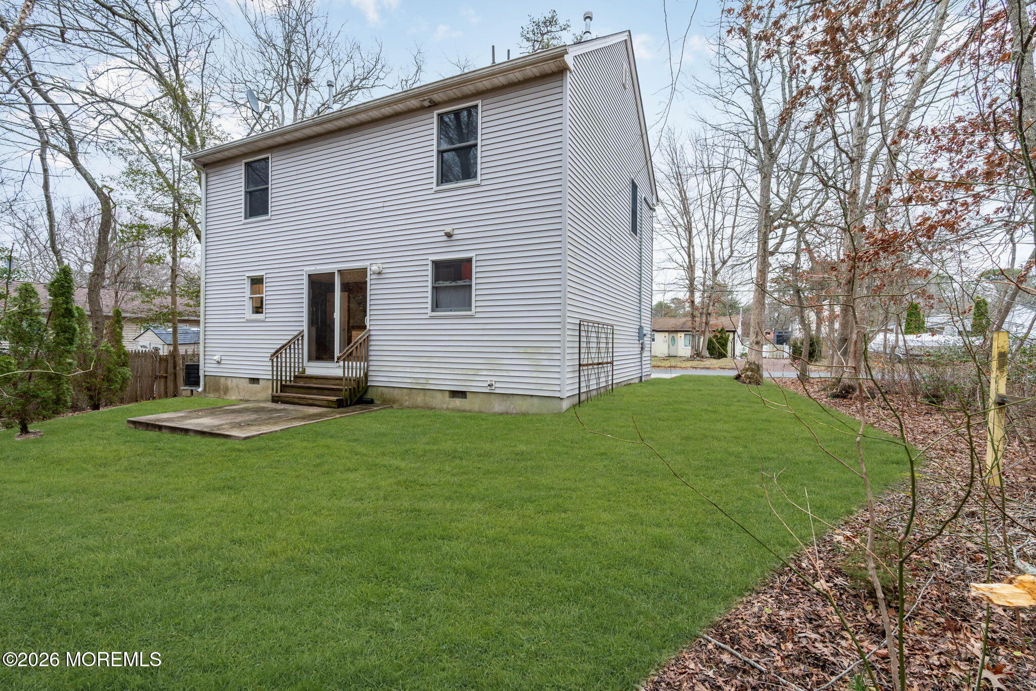 9 Forecastle Way Waretown, NJ 08758 - Photo 41 of 51 a view of a backyard with table and chairs potted plants and large tree