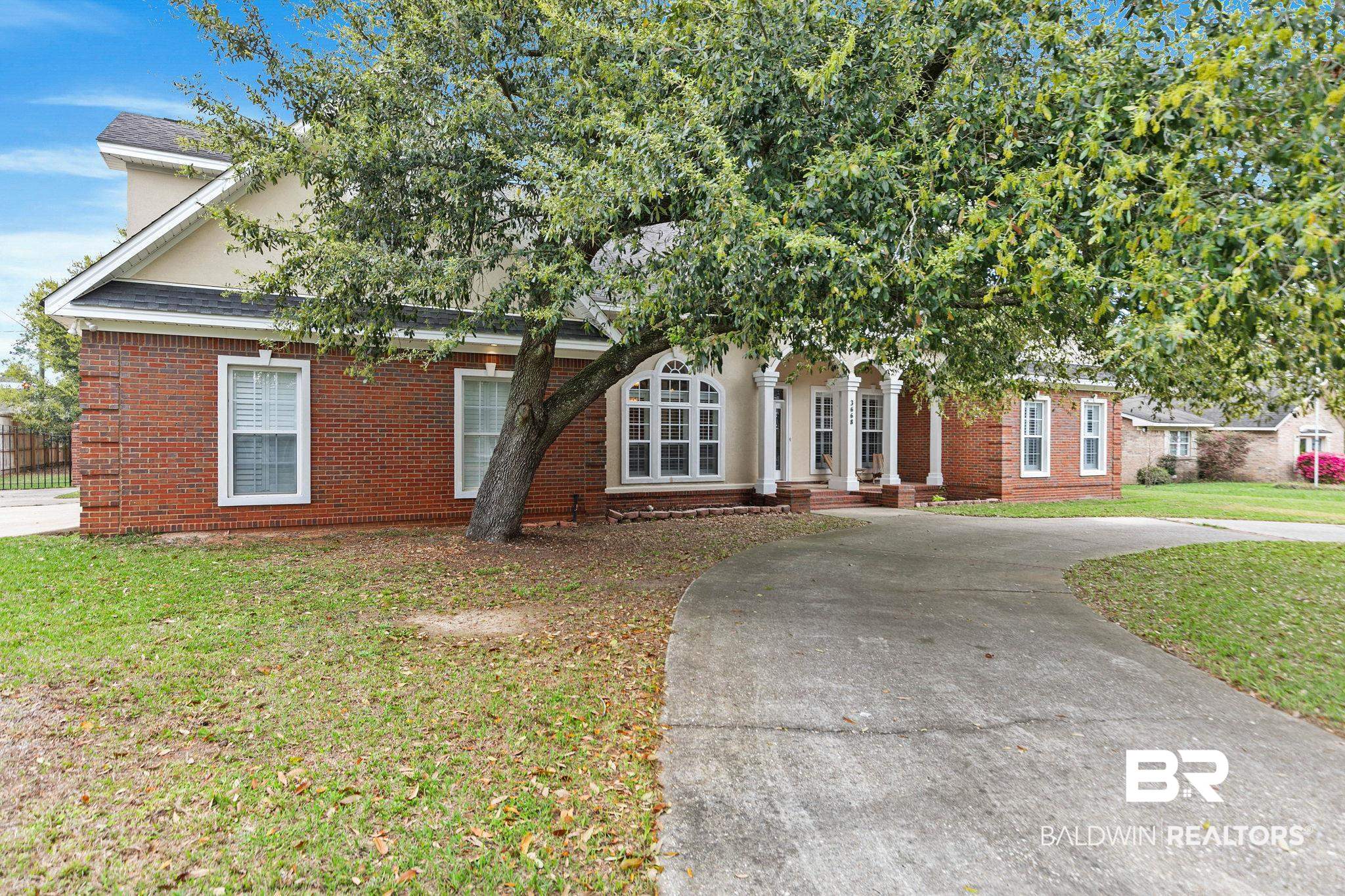 3668 Claridge Road North Mobile, AL 36608 - Photo 5 of 100 Obstructed view of property featuring a front lawn and brick siding