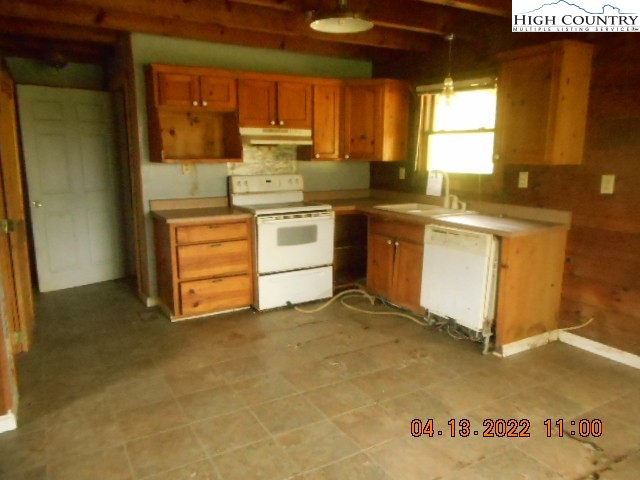 250 Hicks Grv Rd Extension Mooresboro, NC 28114 - Photo 8 of 28 a kitchen with stainless steel appliances granite countertop a stove a sink and a refrigerator