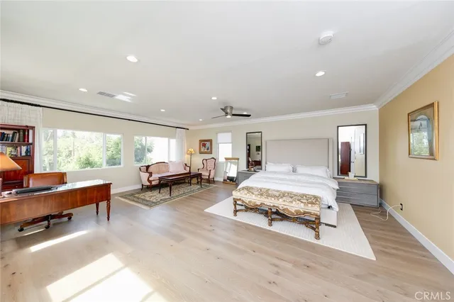 a living room with furniture a window and a book shelf