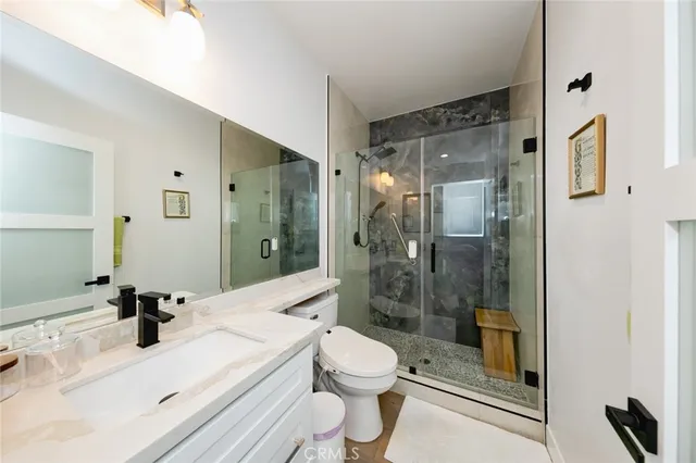 a kitchen with stainless steel appliances granite countertop a refrigerator a stove top oven a sink and dishwasher