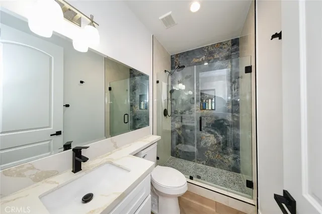 a view of a patio with a table chairs and a backyard