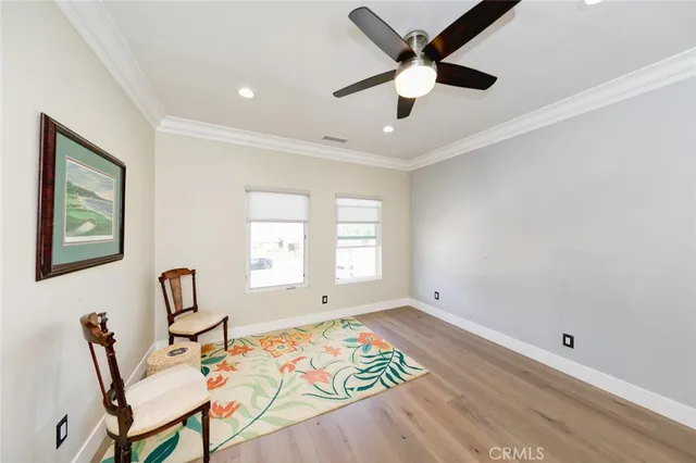 a view of a patio with table and chairs potted plants and palm tree