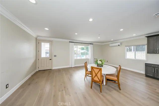 a view of a chairs and table in backyard of the house