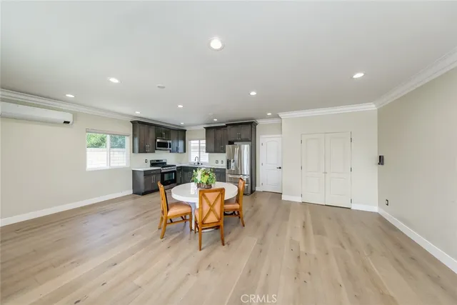a view of a porch with a table and chairs