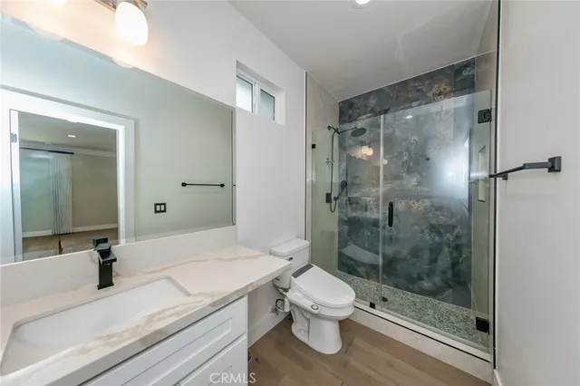 a front view of a house with garden and patio