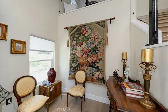 a kitchen with stainless steel appliances granite countertop a stove a refrigerator and a white cabinets