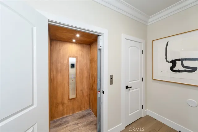 a kitchen with stainless steel appliances a refrigerator and a window