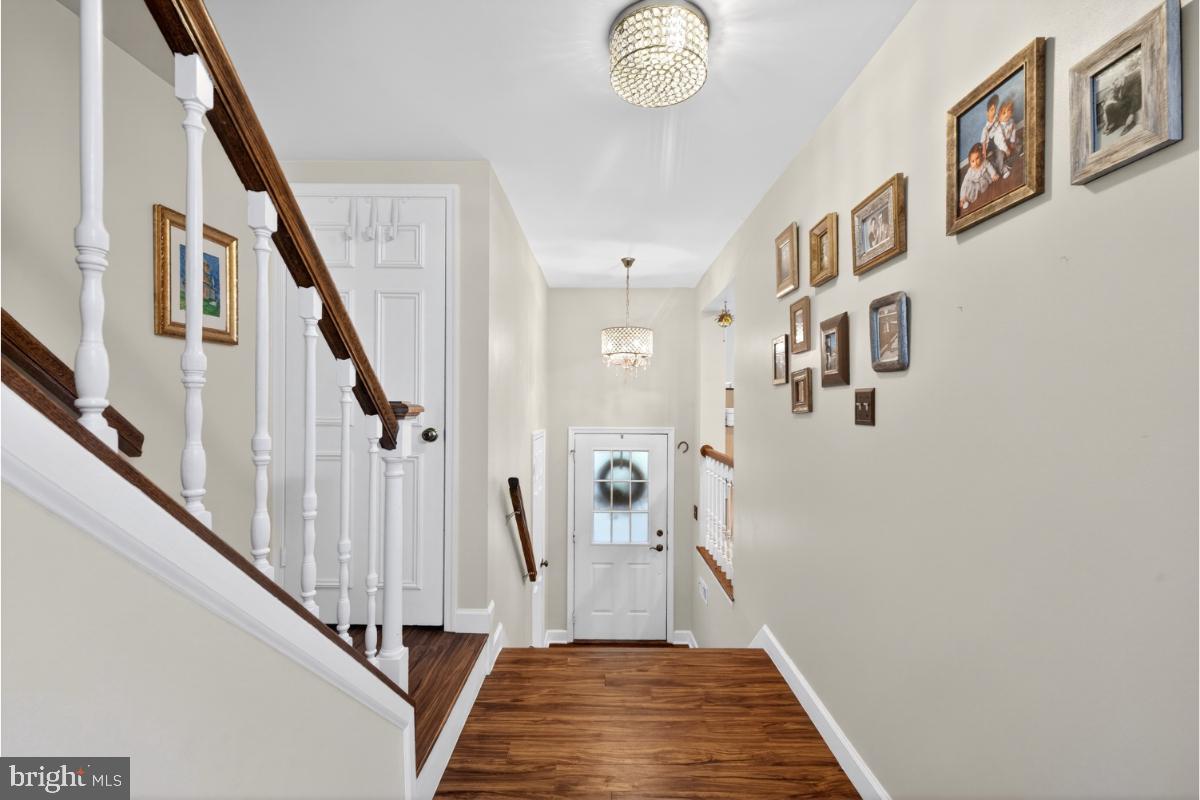 7347 Swan Point Way, Unit 122 Columbia, MD 21045 - Photo 9 of 54 a view of a hallway with windows and stairs