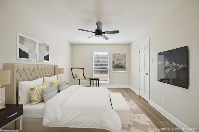 a bedroom with a large bed and a window