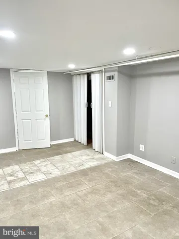 a view of a chairs and table in a backyard