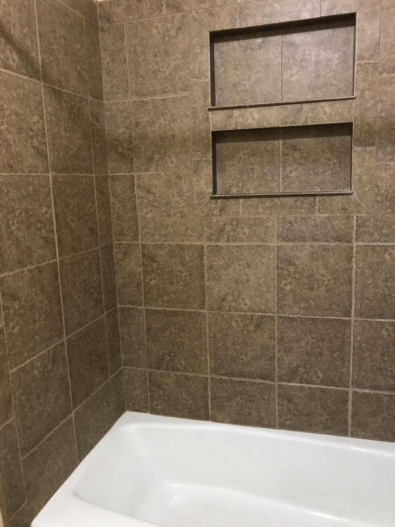 4632 Cline Road Amarillo, TX 79110 - Photo 12 of 27 a bathroom with a shower