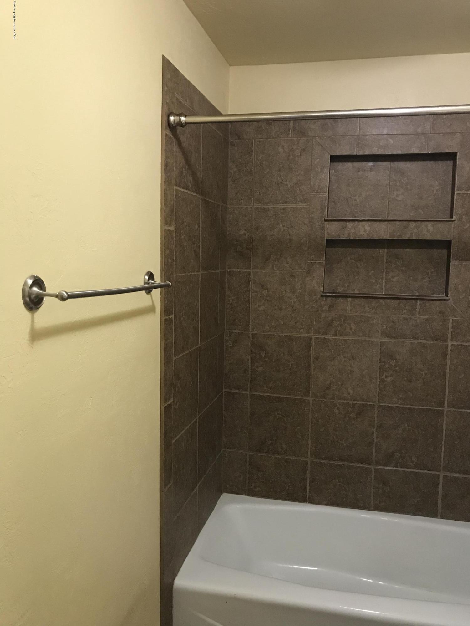 4632 Cline Road Amarillo, TX 79110 - Photo 13 of 27 a bathroom with a shower