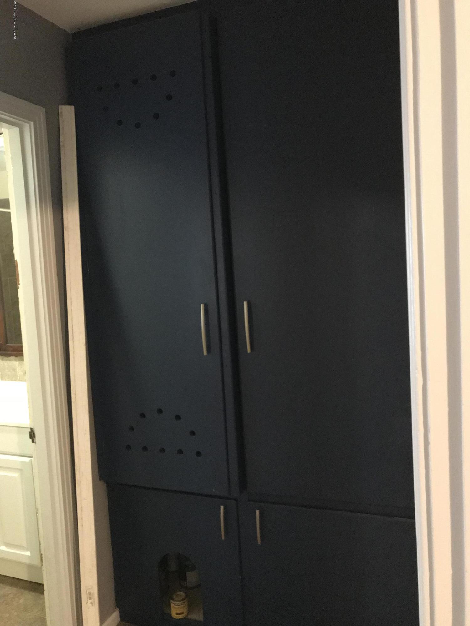 4632 Cline Road Amarillo, TX 79110 - Photo 15 of 27 a close view of cupboard