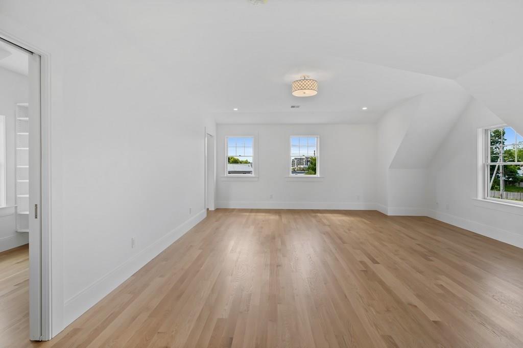 36 Bulow Road Hingham, MA 02043 - Photo 23 of 40 an empty room with wooden floor and windows
