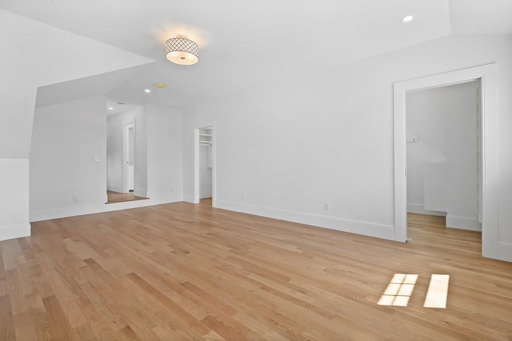 36 Bulow Road Hingham, MA 02043 - Photo 26 of 40 a view of an empty room with wooden floor and a window