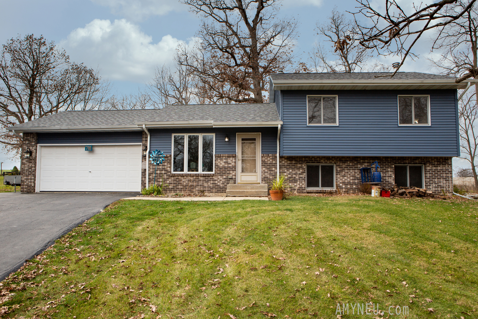 718 Heathcliff Court Davis, IL 61019 - Photo 1 of 18 a front view of a house with a garden