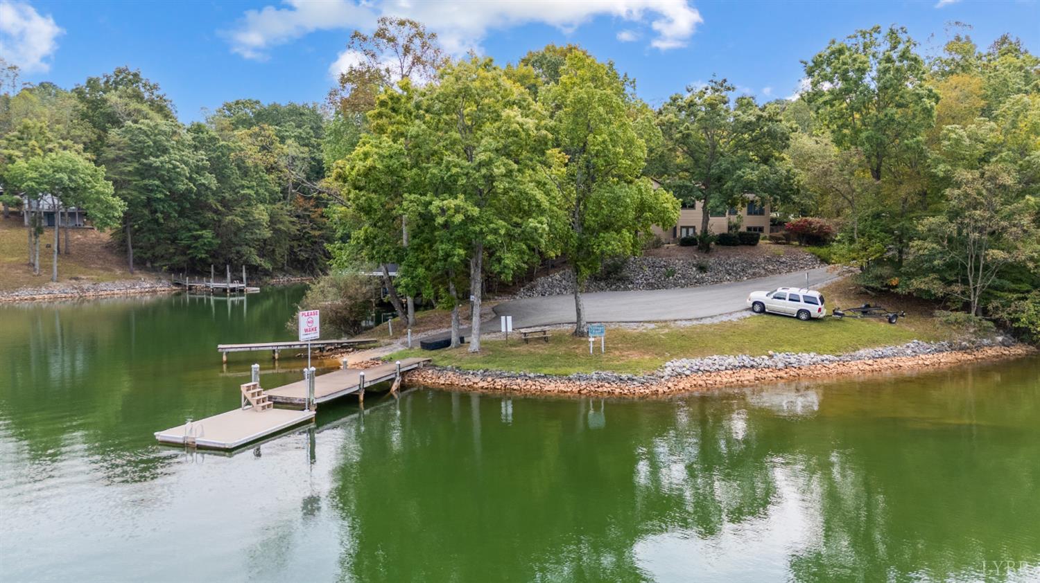 101 Little Creek Road Moneta, VA 24121 - Photo 20 of 76 a view of a lake with a house in the background