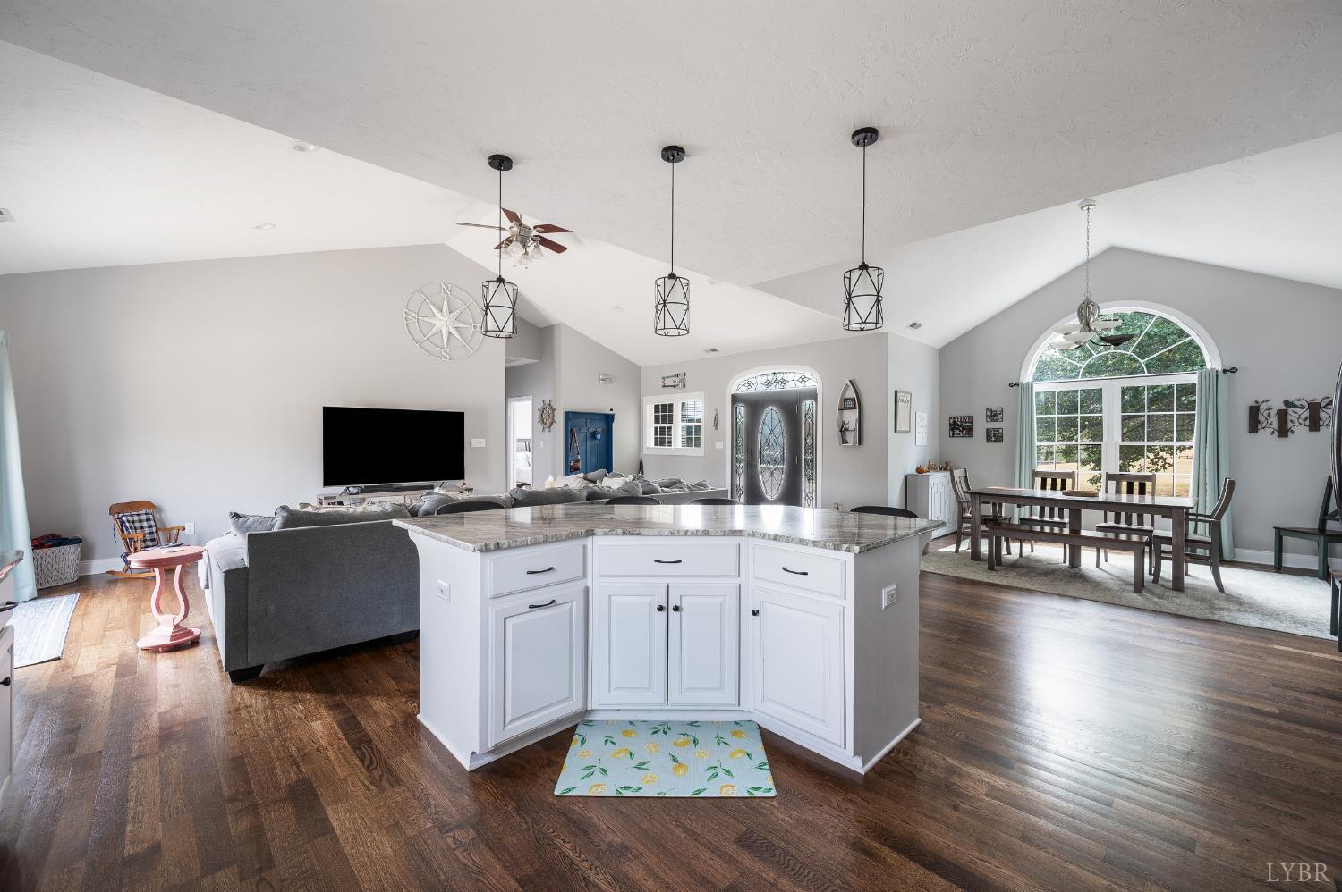 101 Little Creek Road Moneta, VA 24121 - Photo 30 of 76 a living room with furniture a flat screen tv and wooden floor