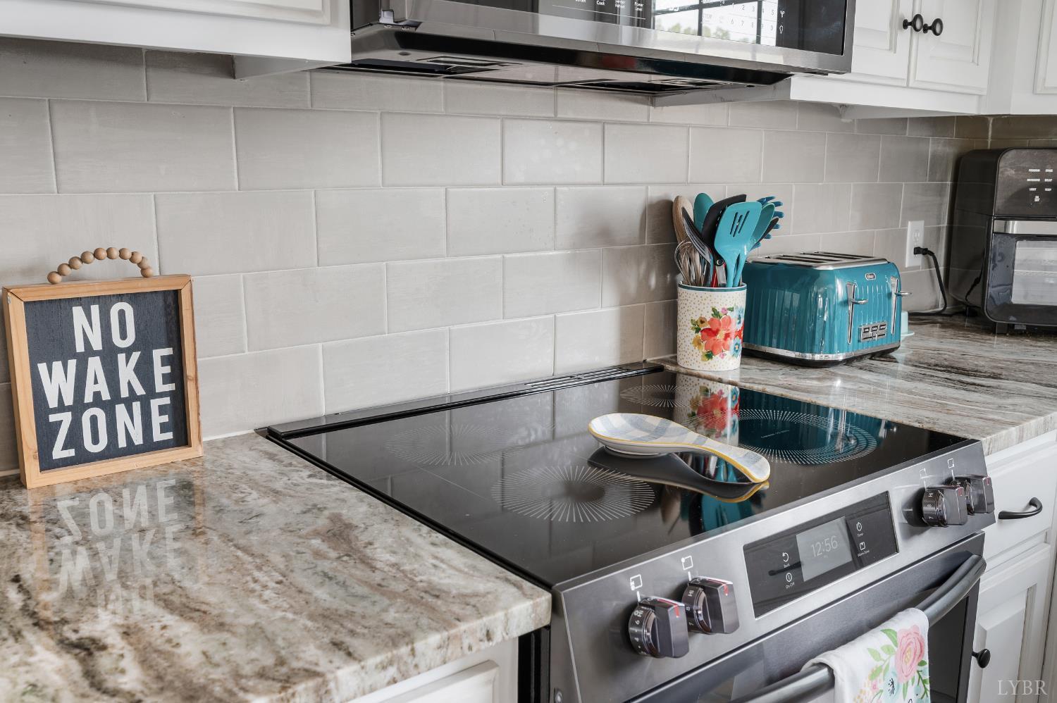 101 Little Creek Road Moneta, VA 24121 - Photo 32 of 76 a kitchen with stainless steel appliances granite countertop a sink and a stove