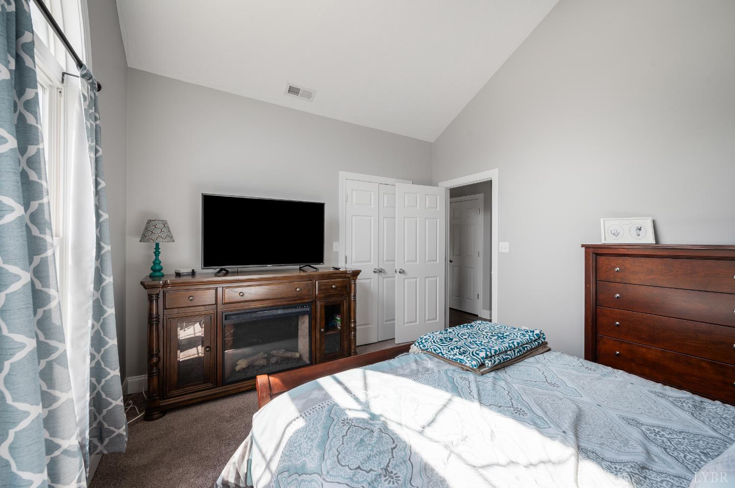 101 Little Creek Road Moneta, VA 24121 - Photo 39 of 76 a bedroom with a bed and a flat screen tv