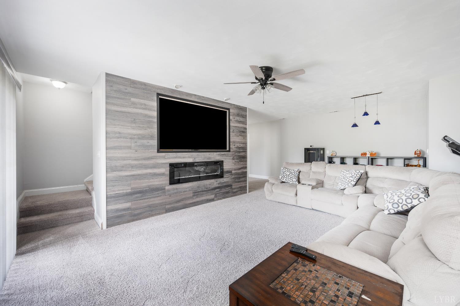 101 Little Creek Road Moneta, VA 24121 - Photo 66 of 76 a living room with furniture and a flat screen tv